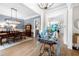 Elegant dining room with hardwood floors, modern chandelier, and stylish decor at 1741 Hickory Path Way, Suwanee, GA 30024