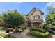 Charming two-story home with a beautifully landscaped front yard and inviting front porch at 1741 Hickory Path Way, Suwanee, GA 30024