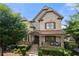 Charming two-story home with a beautifully landscaped front yard and inviting front porch at 1741 Hickory Path Way, Suwanee, GA 30024