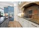 Gourmet kitchen featuring granite countertops, stainless steel appliances, and custom cabinetry at 1741 Hickory Path Way, Suwanee, GA 30024