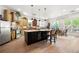 Eat-in kitchen featuring a wine rack, stainless steel appliances, and ample counter space at 1741 Hickory Path Way, Suwanee, GA 30024