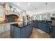 Spacious kitchen with custom cabinets, granite countertops, and stainless steel appliances at 1741 Hickory Path Way, Suwanee, GA 30024