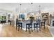 Open kitchen with center island, modern appliances, and breakfast bar seating at 1741 Hickory Path Way, Suwanee, GA 30024