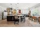 Eat-in kitchen featuring a wine rack, stainless steel appliances, and ample counter space at 1741 Hickory Path Way, Suwanee, GA 30024