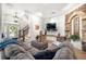 Inviting living room with stone accent wall, fireplace, and modern decor at 1741 Hickory Path Way, Suwanee, GA 30024