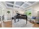 Sophisticated living room featuring coffered ceilings and a sleek grand piano at 1741 Hickory Path Way, Suwanee, GA 30024