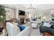 Cozy living room with fireplace and built-in shelving, filled with natural light at 1741 Hickory Path Way, Suwanee, GA 30024