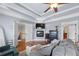 Open and airy main bedroom with fireplace, ceiling fan and multiple closets at 1741 Hickory Path Way, Suwanee, GA 30024