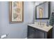 Charming powder room with modern vanity and elegant decor at 1741 Hickory Path Way, Suwanee, GA 30024