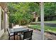 Charming backyard featuring a spacious deck, dining area, and a custom-built treehouse for outdoor enjoyment at 2460 Drew Valley Ne Rd, Brookhaven, GA 30319