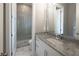 Bathroom featuring granite countertops, a modern sink, and glass-enclosed shower at 2460 Drew Valley Ne Rd, Brookhaven, GA 30319