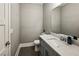 Bathroom featuring a gray vanity, modern fixtures, and a marble countertop at 2460 Drew Valley Ne Rd, Brookhaven, GA 30319