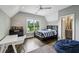Comfortable bedroom with a ceiling fan, large window, and a connected full bathroom at 2460 Drew Valley Ne Rd, Brookhaven, GA 30319