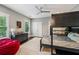 A well-lit bedroom with a bunk bed, dresser, and a comfortable beanbag chair, perfect for a room at 2460 Drew Valley Ne Rd, Brookhaven, GA 30319
