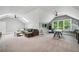 Bright bonus room with skylights, carpet, and an entertainment area with a TV and comfortable seating at 2460 Drew Valley Ne Rd, Brookhaven, GA 30319