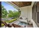 Relaxing front porch featuring a comfortable porch swing, chairs, and charming neighborhood views at 2460 Drew Valley Ne Rd, Brookhaven, GA 30319