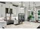 Well-appointed kitchen featuring a large center island, stainless steel appliances, and modern lighting at 2460 Drew Valley Ne Rd, Brookhaven, GA 30319