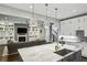 Modern open-concept kitchen with stainless steel appliances and large center island leading to the living room at 2460 Drew Valley Ne Rd, Brookhaven, GA 30319
