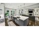 Open-concept kitchen flowing into the living area, featuring a spacious island with sink and seating at 2460 Drew Valley Ne Rd, Brookhaven, GA 30319