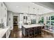 Modern kitchen featuring a large center island with seating, stainless steel appliances, and sleek cabinetry at 2460 Drew Valley Ne Rd, Brookhaven, GA 30319