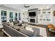 Cozy living room with a fireplace, built-in bookshelves, and access to a private outdoor space at 2460 Drew Valley Ne Rd, Brookhaven, GA 30319