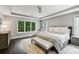 Spacious main bedroom with a tray ceiling, recessed lights, and a large window at 2460 Drew Valley Ne Rd, Brookhaven, GA 30319
