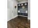 Convenient mudroom with a built-in bench, cubbies, and hooks for coats and bags at 2460 Drew Valley Ne Rd, Brookhaven, GA 30319