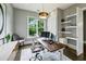 Well-appointed home office with natural light, built-in shelving, and a comfortable workspace at 2460 Drew Valley Ne Rd, Brookhaven, GA 30319