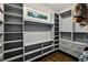 Spacious walk-in closet with built-in storage solutions and natural light at 2460 Drew Valley Ne Rd, Brookhaven, GA 30319