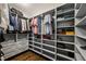 Organized walk-in closet with custom shelves, drawers, and hanging space at 2460 Drew Valley Ne Rd, Brookhaven, GA 30319