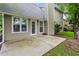 View of the back of the home and the neutral-colored concrete patio at 4710 Vineyard Se Ct, Smyrna, GA 30082