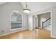 Spacious dining room showcasing hardwood floors, a large window, and neutral paint at 4710 Vineyard Se Ct, Smyrna, GA 30082