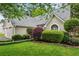 Beautiful home exterior with well-manicured landscaping and two-car garage at 4710 Vineyard Se Ct, Smyrna, GA 30082