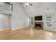 Inviting living room with stone fireplace, high ceilings, and hardwood flooring at 4710 Vineyard Se Ct, Smyrna, GA 30082