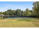 Outdoor tennis court features a basketball hoop on a well-maintained lawn, perfect for active recreation and neighborhood fun at 4710 Vineyard Se Ct, Smyrna, GA 30082