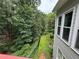 View of lush, mature trees from the backyard fence line at 703 Overlook Point, Woodstock, GA 30189