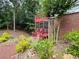 A lush green backyard and elevated patio. Mature trees provide privacy at 703 Overlook Point, Woodstock, GA 30189
