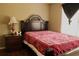 Cozy bedroom with a queen bed, wooden furniture, and large window at 703 Overlook Point, Woodstock, GA 30189