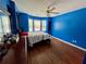 Bright bedroom with a queen bed, wood floors, and large window at 703 Overlook Point, Woodstock, GA 30189