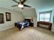 Cozy bedroom with a bed, a foosball table, and a ceiling fan at 703 Overlook Point, Woodstock, GA 30189