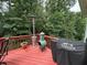 Outdoor deck features a grill, patio heater, and comfortable seating for outdoor enjoyment at 703 Overlook Point, Woodstock, GA 30189