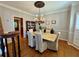 Dining room with wood floors, chandelier, and shuttered windows at 703 Overlook Point, Woodstock, GA 30189