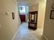 Spacious foyer with high ceilings, chandelier, tiled floor and staircase provides a grand entrance at 703 Overlook Point, Woodstock, GA 30189