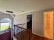 Bright foyer with a chandelier with a view to another room and stairs at 703 Overlook Point, Woodstock, GA 30189