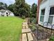 Charming two-story home with a lush green lawn and beautifully landscaped walkway at 703 Overlook Point, Woodstock, GA 30189