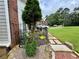 Landscaped garden beds create curb appeal and welcome you home at 703 Overlook Point, Woodstock, GA 30189