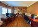 Office features hardwood flooring, built-in bookcase, and windows for ample natural light at 703 Overlook Point, Woodstock, GA 30189