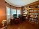 Beautiful office featuring hardwood floors, built-in bookcase, and shuttered windows at 703 Overlook Point, Woodstock, GA 30189