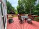 Outdoor deck perfect for entertaining, featuring a dining table and a lovely view at 703 Overlook Pt, Woodstock, GA 30189