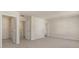 Bright bedroom featuring a walk-in closet and an open doorway to the bathroom at 8225 Coldstream Dr, Fairburn, GA 30213